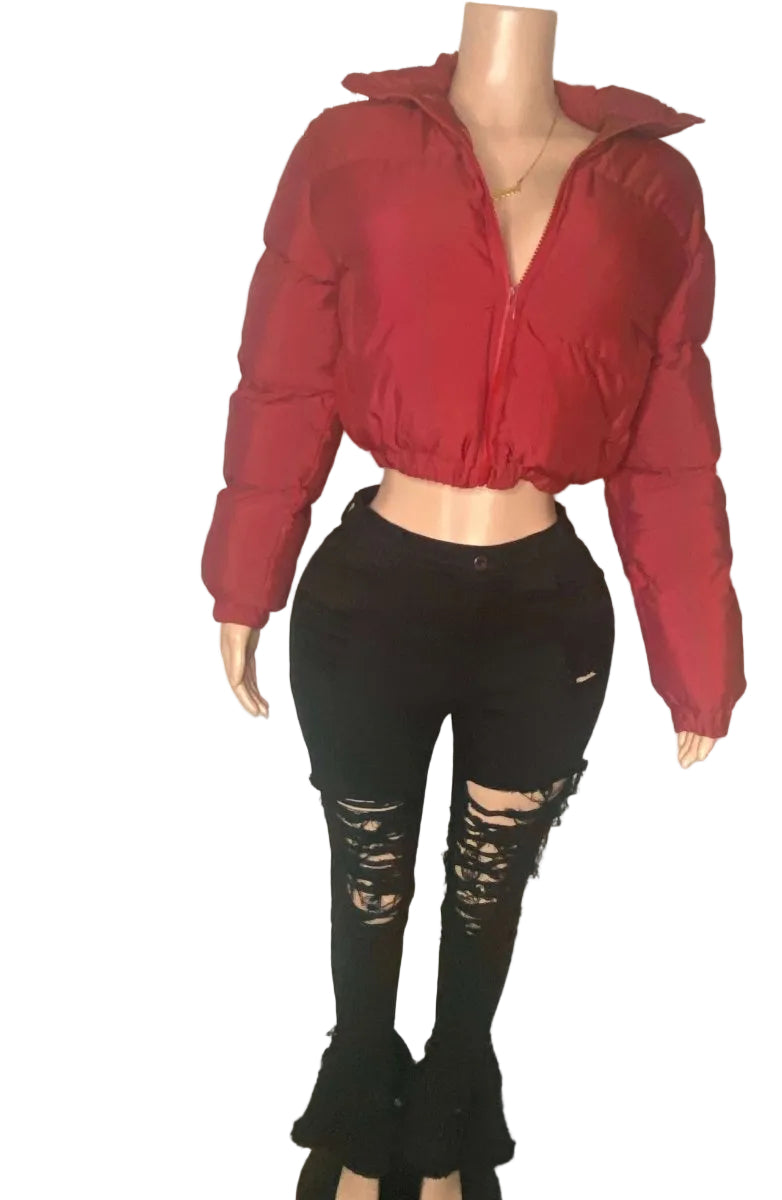 Mannequin wearing a red jacket and black ripped jeans with 'IKONIK' branding in the background.