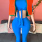 Blue 2 piece pant set crop top for spring or fall season, orange vest, orange sunglasses color block 