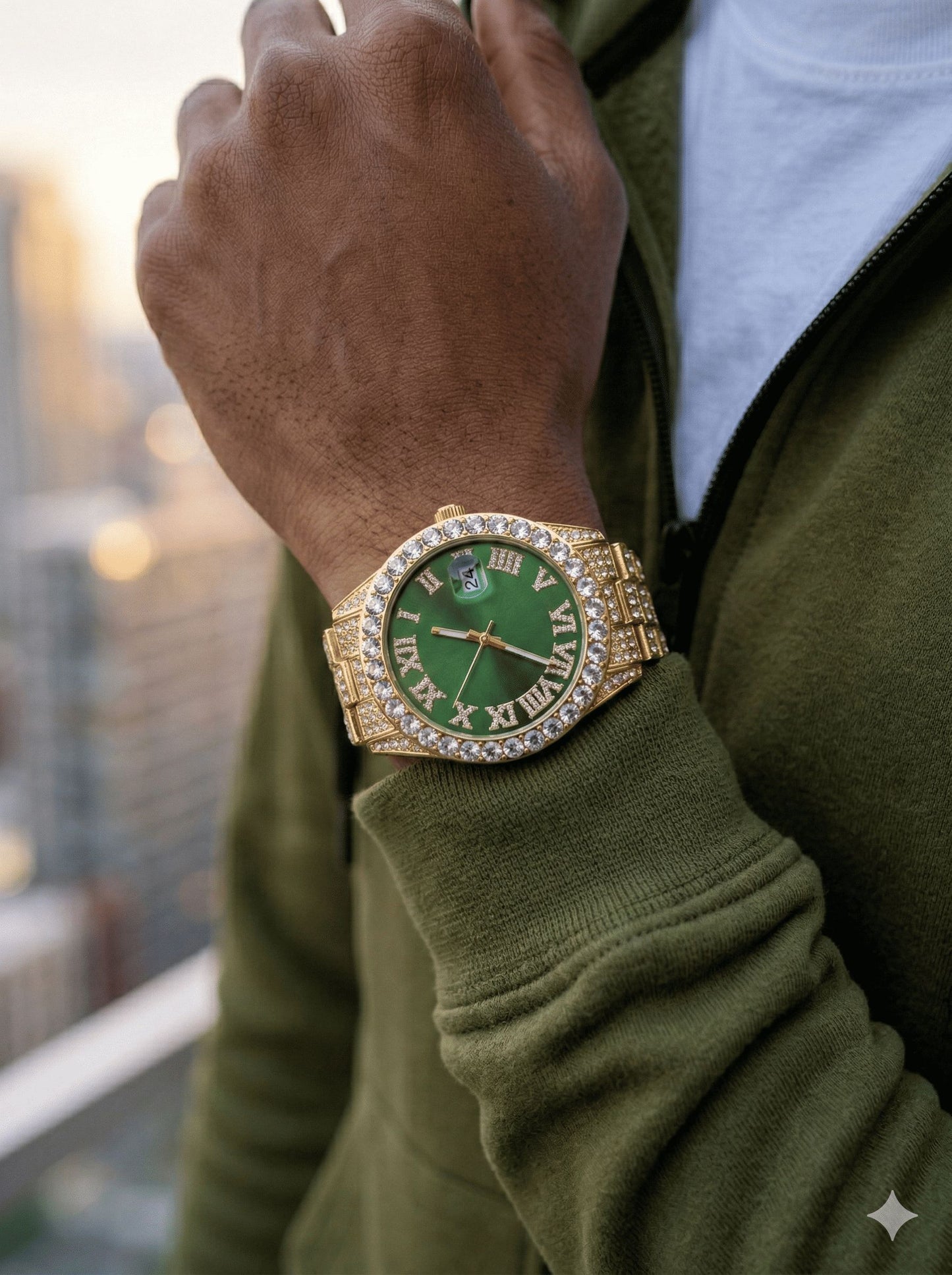 Hand wearing a gold watch with a green face, blurred background
