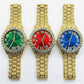 Three gold-iced out watches with green, red, and blue faces on a white background