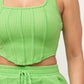 woman wearing lime green 2 piece short set great material