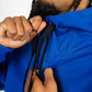Close-up of royal blue men’s tech fleece hoodie showing drawstrings and premium fleece texture.