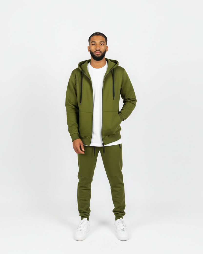 Front view of olive green men’s matching sweatsuit with white undershirt peeking out, clean minimal background.