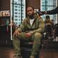 Olive green men’s tech fleece set worn at barbershop during lineup, styled with Air Max 97 sneakers.