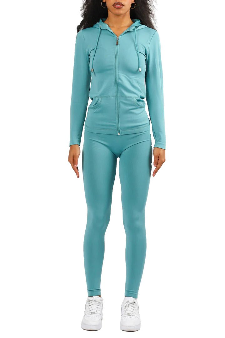 Model wearing a teal long-sleeve athletic set for spring, summer, fall