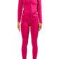 Woman in magenta pink lounge set with sneakers styled for casual streetwear outfit idea on white background