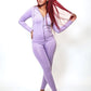 Purple two-piece lounge set worn by confident woman styled for warmth and stretch