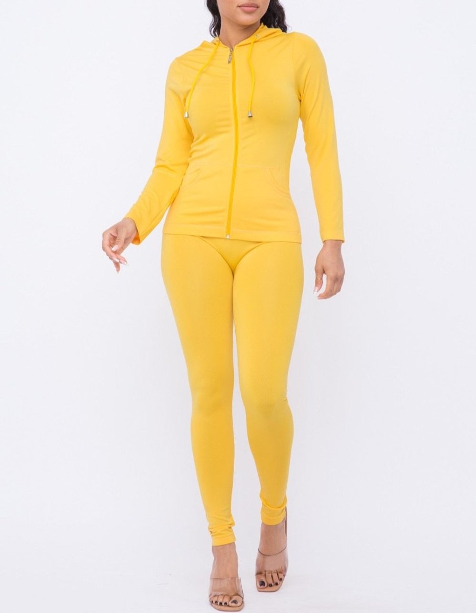 Athleisure outfit idea featuring matching jacket yellow legging set on confident plus-size woman