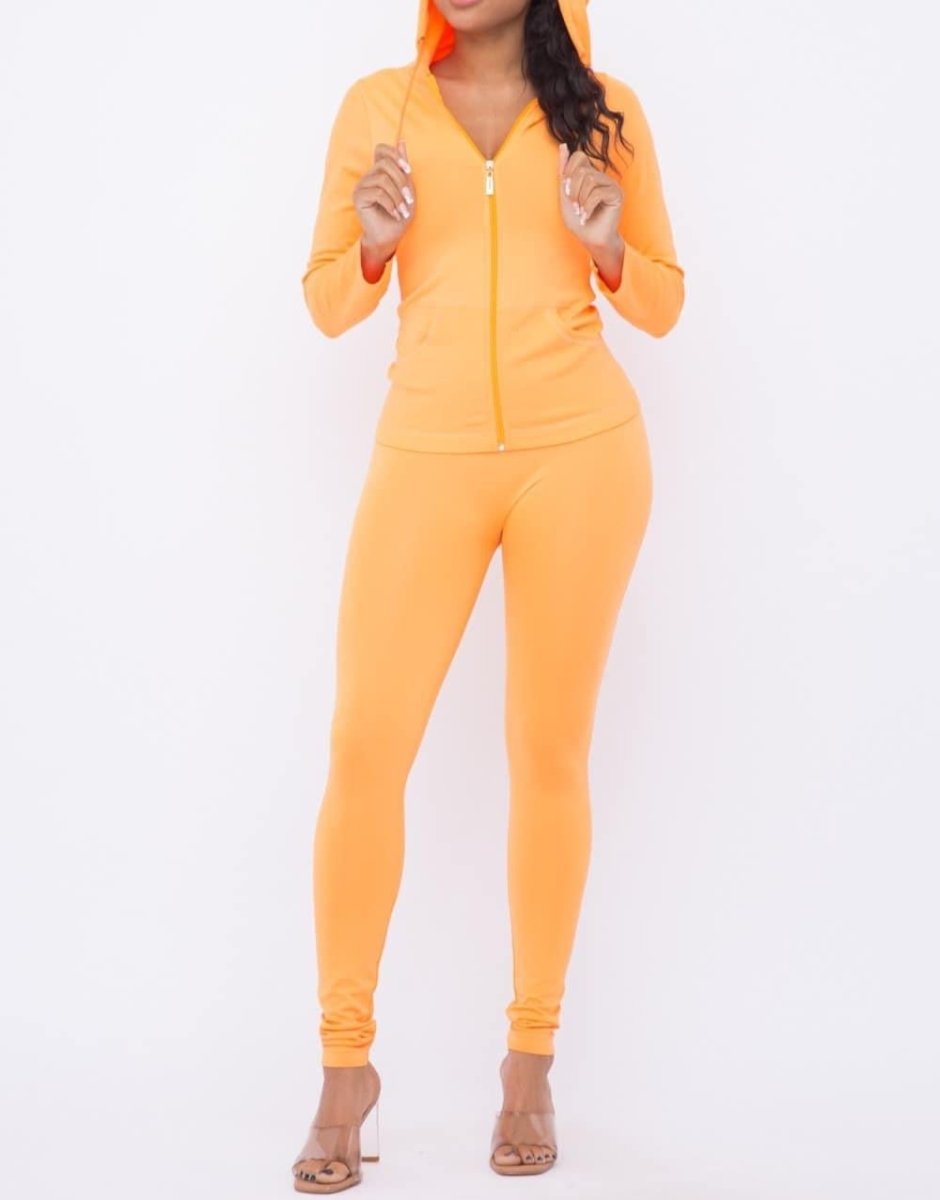 Neon orange leggings and jacket set styled with heels for plus-size women who love bold comfy outfits