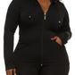 Plus-size woman in black long sleeve legging set styled for comfy airport outfit or errands
