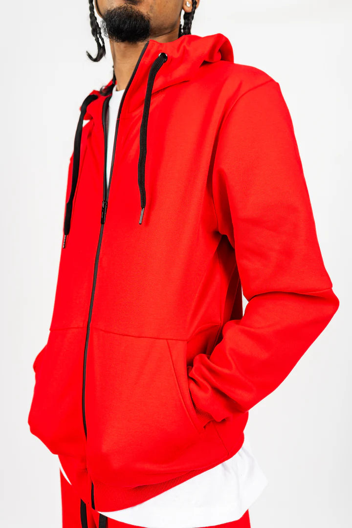 Red men’s tech fleece tracksuit from Ikonik Kingz, black zipper details, studio photo on white background.