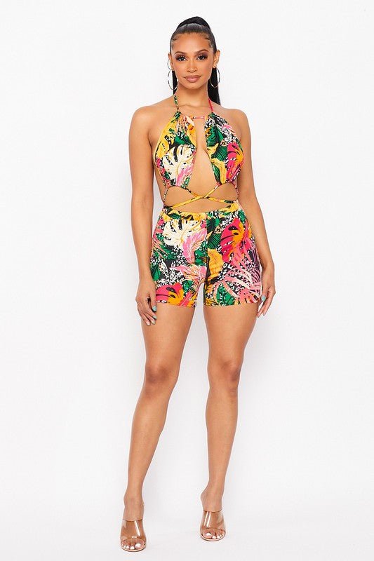 Woman wearing a colorful printed romper outfit on vacation