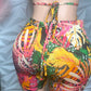 Colorful tropical print shorts on a neutral background