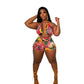 Curvy woman in bright colored printed romper with yellow heels