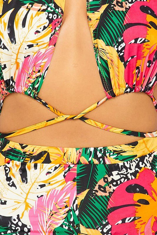 Printed colorful romper with cross detail, up close view